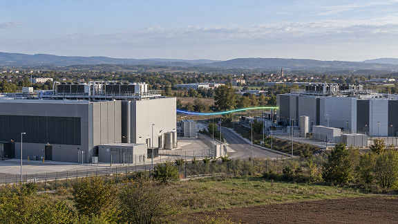 Two data center facilities connected by a digital network link, illustrating high-speed data center interconnection.